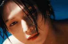 a close up of a woman 's face with water dripping from her nose
