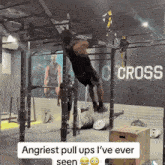 a man is doing pull ups in a gym with the words angriest pull ups i 've ever seen above him