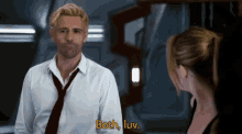 a man in a white shirt and red tie is talking to a woman and the words both luv are on the screen