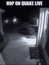 a black and white photo of a house with the words `` hop on quake live '' on the bottom .