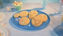 a white plate with a cookie on it that has candy on it