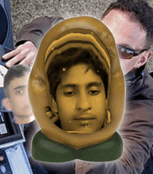 a man is taking a picture of a boy with a hood on his head