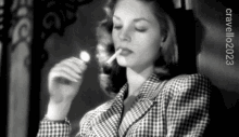 Light Up Lauren Bacall GIF - Light Up Lauren Bacall Light A Cigarette GIFs
