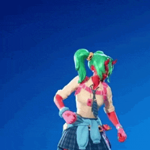 a girl with green hair and red skin is dancing in front of a blue background .