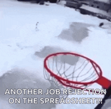 a basketball hoop is sitting in the snow with the words `` another job rejection on the spreadsheet '' written on it .