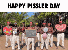 a group of shirtless men holding balloons and a sign that says happy pissler day