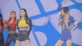 a group of women are dancing in front of a blue background that says gifsdeso0