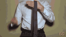 How To Tie A Tie Tying GIF - How To Tie A Tie Tying GIFs