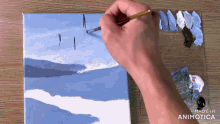 a person is painting a landscape on a canvas with the words made in animatica visible