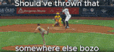 a baseball game is being played with a benjamin moore ad behind the pitcher