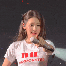 a girl wearing a white shirt that says babymonster