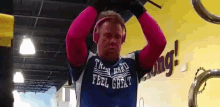 a man wearing a shirt that says " feel great "