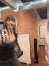 a tiktok video of a woman dancing with the name grace budsarin