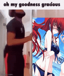 a man standing next to a picture of a girl in a bikini