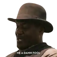 a man wearing a hat with the words he a damn fool above him