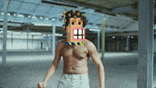 a shirtless man with a pixel face on his face
