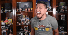 a man wearing a t-shirt that says central perk is screaming