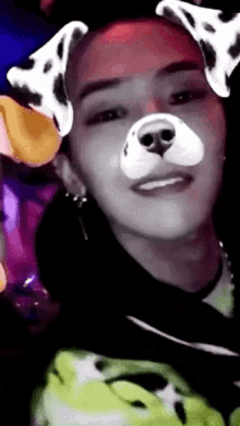 a person wearing a dog mask with dalmatian ears on their face