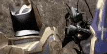a close up of a robot fighting another robot .