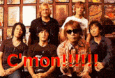 a group of men are posing for a picture with the words c'mon !!! on the bottom right