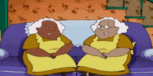 two cartoon characters are sitting on a couch