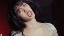 a close up of a woman making a funny face with her mouth open