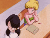 two anime girls are sitting at a desk with a notebook and a pen