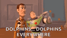 woody and buzz lightyear from toy story are standing next to each other and looking at dolphins everywhere .