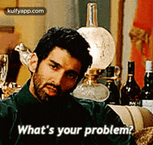 a man with a beard is asking what 's your problem .