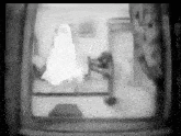 a black and white photo of a ghost in a room .
