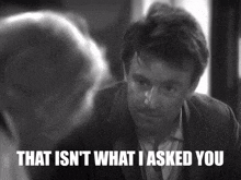 a man in a suit says that isn 't what i asked you in a black and white photo