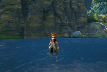 a person is splashing in a body of water with a cliff in the background