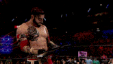 a man in a wrestling ring is wearing a belt that says npw