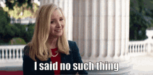 a woman says i said no such thing in front of a white building