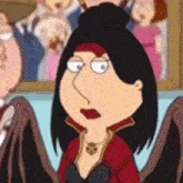 a cartoon character with black hair and wings is sitting in front of a crowd of people .
