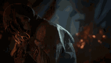 a close up of a person 's face with a hood on