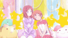 two anime girls are sitting next to each other in a room