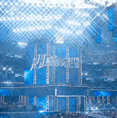 a wrestling stadium with a sign that says phenomen