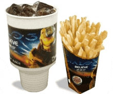 a cup of soda and a cup of french fries with believe written on them