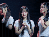 a girl with long hair stands in front of a microphone and a sign that says ' ss ' on it