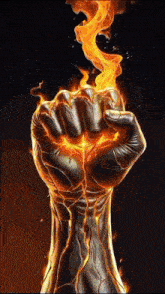 a fist with fire coming out of it on a dark background .