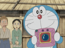 a cartoon of doraemon holding a pink camera with the number 00 on his face