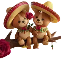 two teddy bears wearing sombrero sitting on a tree branch