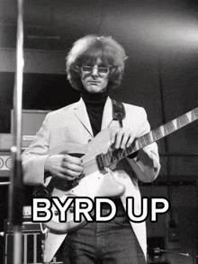 a man playing a guitar with the words byrd up written above him