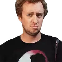 a man with a beard is wearing a black shirt with a picture of a man on it