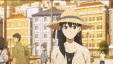 a woman wearing a straw hat is smiling in front of a city