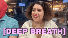 a woman sitting on a bench with the words [ deep breath ] on her chest