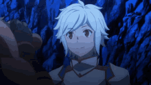 a boy with short white hair is standing in front of a blue background