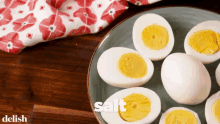 Boiled Eggs With Salt And Pepper Food Garnishing GIF - Boiled Eggs With Salt And Pepper Food Garnishing Sprinkle Of Salt And Pepper GIFs
