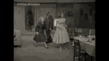 a black and white photo of three women dancing in a living room with the caption @ 1chica random